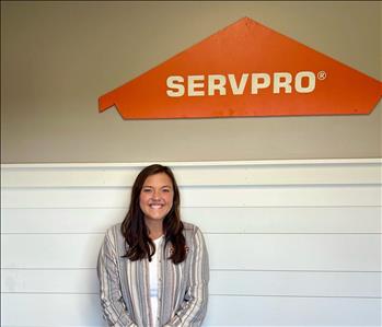 Employee by SERVPRO sign.