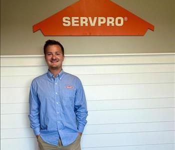 Employee by SERVPRO sign.